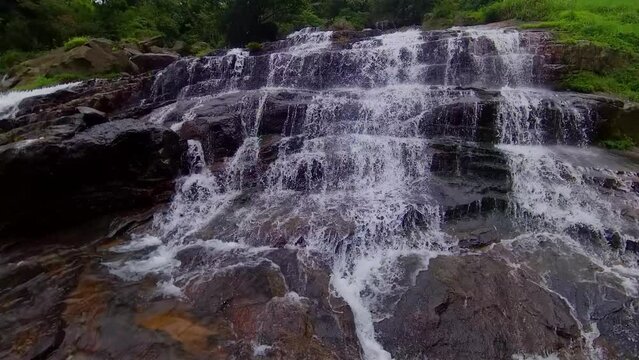 Waterfall in the tropical mountain jungle. Ramboda Falls, Sri Lanka.