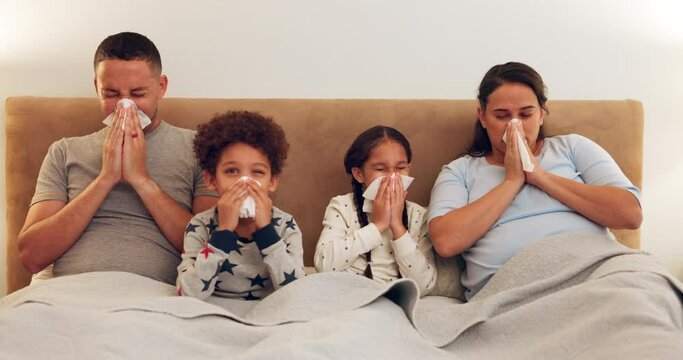 Sick, bed and family blowing their nose while relaxing together with a cold, flu or allergies. Illness, rest and parents in hayfever recovery with their children in the bedroom of their modern house.