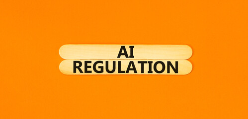 AI regulation symbol. Concept words AI artificial intelligence regulation on beautiful wooden stick. Beautiful orange background. Business AI artificial intelligence regulation concept. Copy space