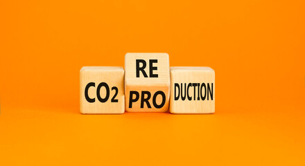 CO2 production or reduction symbol. Concept word CO2 production reduction on a wooden block on a...