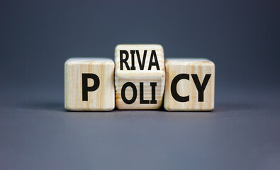 Privacy policy symbol. Concept words Privacy policy on wooden block on a beautiful grey table grey...