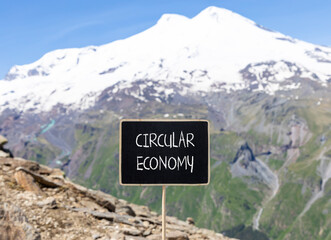 Circular economy symbol. Concept words Circular economy on beautiful black blackboard. Beautiful...