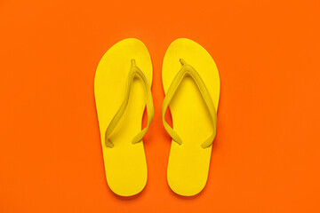 Yellow flip-flops on red background