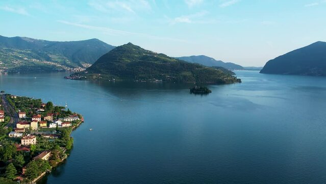 Aerial 4K footage of Loreto Island with the castle on Lake Iseo in Northern Italy, Brescia, Lombardy.