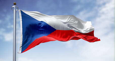 Naklejka na ściany i meble The Czech Republic national flag proudly waves on a clear day