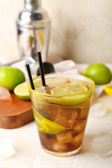 Glass of tasty Cuba Libre cocktail on table