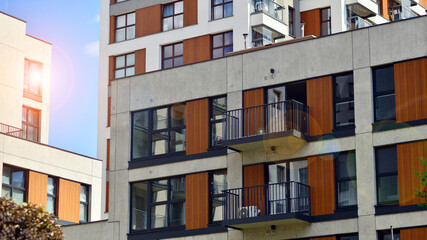 Modern apartment buildings on a sunny day with a blue sky. Facade of a modern apartment building