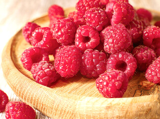 Fresh raspberry on wooden board