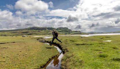 woman hiking on the isle of Colonsay, Scotland