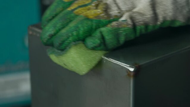 Process of welds passivation at steel factory. Creative. Substance for welds protection.
