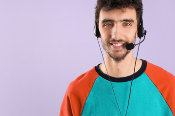 Male technical support agent on lilac background