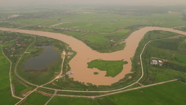 Aerial tracking view Pengkalan Sepit Biru Permatang Berangan at Sungai Muda which is border for Penang and Kedah