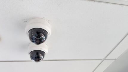 security cameras symbolize surveillance, safety, control, and privacy concerns in modern society