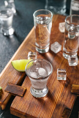 Obraz na płótnie Canvas Glasses of cold vodka on black background