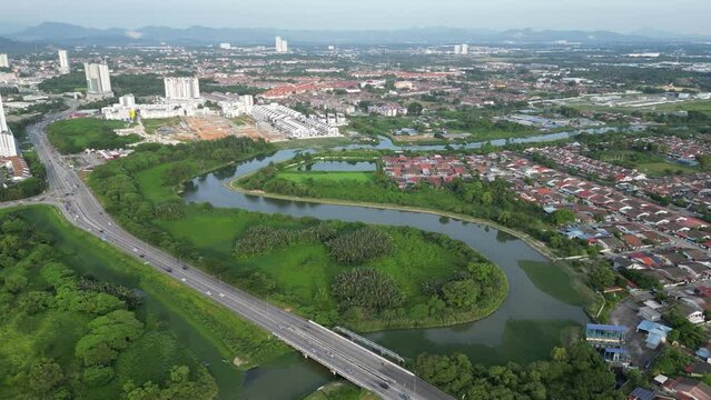 An aerial view of a Taman Sri Rambai residential area and a Sungai Juru river
