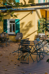Garden Furniture For Leisure Time In Nature. Empty Chairs And Table Table In Orchard. Wooden Outdoor Furniture Set For Picnic In Autumn Garden. Cozy Interior Courtyard With Table And Chair In Village