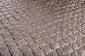 quilted quilt and texture of warm stitched fabric
