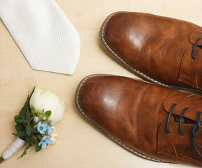 Prepared for wedding - detail of shoes, tie and Boutonniere flower