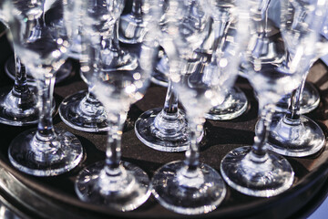 Bunch of clean narrow glasses on the plate. Close-up