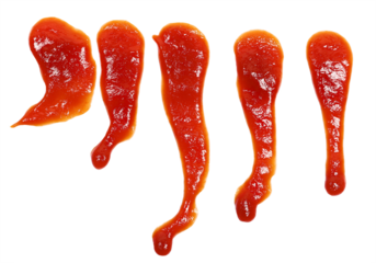 Red ketchup splashes isolated on white background, tomato puree texture