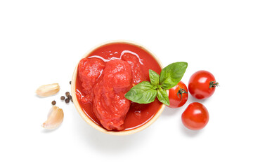 Bowl of canned tomatoes and spices on white background