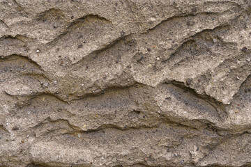 Texture of a concrete wall with indentations