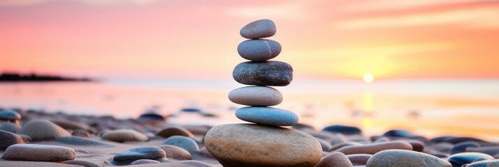 Zen stone tower with peaceful sea and sky bokeh