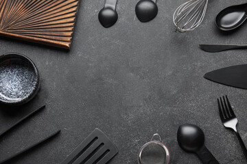 Frame made of different kitchen utensils on dark background, closeup