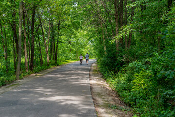 Fototapeta premium People Walking On The Fox River Trail Near De Pere, Wisconsin, In Summer