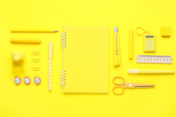 Composition with stationery on yellow background