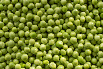 Green Peas. Green background. Peas background. Top view.