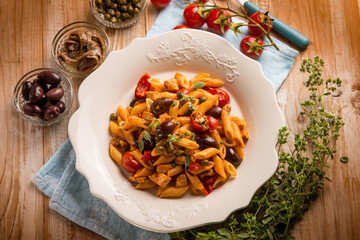 pasta with sword fish tomato black olives and capers