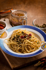 spaghetti with anchovies dried tomatoes and capers