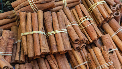 Bunch of cinnamon sticks at Egypt bazaar spice store, Istanbul, Turkey. Oriental cooking and...