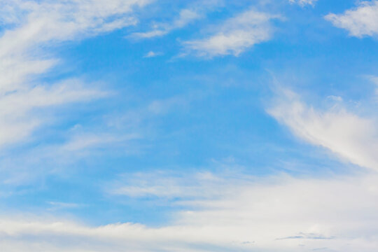Beautiful cirrus clouds at sunrise in summer sunny day. Nature atmosphere background or wallpaper