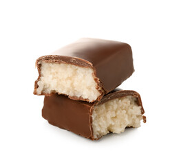 Halves of tasty chocolate covered coconut candy on white background