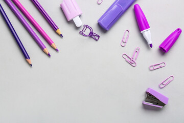 Set of different stationery with color pencils on light background