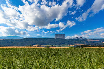 Corn field and Temelin nuclear power plant on the horizon