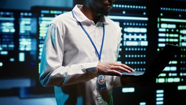 Engineer making sure servers in cloud computing business service are correctly equipped to provide redundancy, automatic failover and rapid reconfiguration of clusters to minimize failure of hardware
