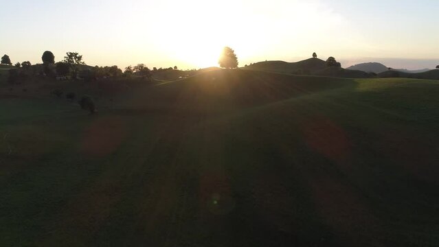 Sunset at a drumlin, geological formation from the ice age, hill with trees, drone shot, Menzingen, Zug, Switzerland, Europe