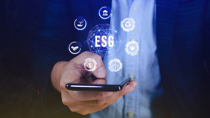 ESG icon concept use a smartphone to analyze ESG for environmental, social and governance in...
