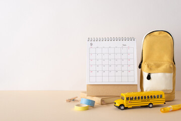 Awaiting school year: Side view shot of desk adorned with September calendar, stationery,...