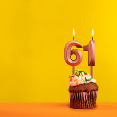 Number 61 birthday candle - Celebration on yellow background