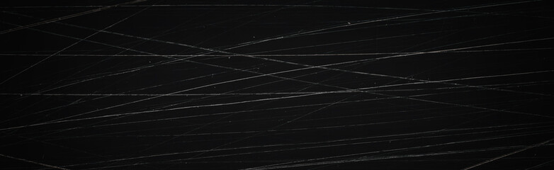 Dark wide panoramic background. Scratched film texture. Lots of scratched lines in different...