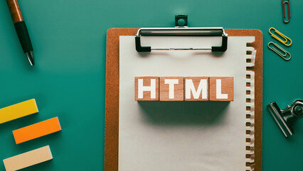 There is wood cube with the word HTML. It is an abbreviation for Hyper Text Markup Language as...