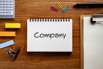 There is notebook with the word Company. It is as an eye-catching image.