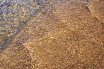 Clean water on a beach of Lagos, Portugal.