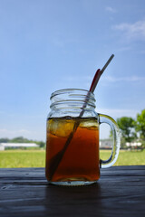 fresh iced tea served in a transparent glass