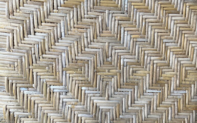 Unique pattern of woven bamboo criss-cross and dry old babu material texture with natural color for background