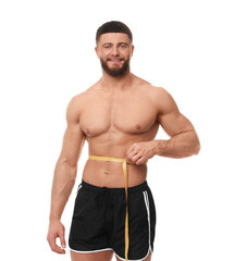 Fototapeta premium Happy athletic man measuring waist with tape on white background. Weight loss concept